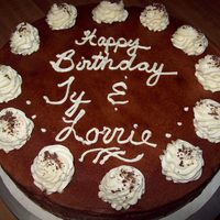 Chocolate Cheesecake chocolate cheesecake with white buttercream rosettes/choc shavings