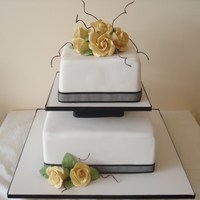 2 Tier Square Wedding Cake Very simple square cake with sugar roses and 'twigs' made from covered wire.
