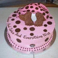 Baby Bottom all iced in buttercream except for the feet, legs and he blanket.