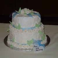 60Th Wedding Anniversary Buttercream with fondant "Duff" roses. There was a minor debacle involving a cat and dried fondant leaves, so I had fewer than...