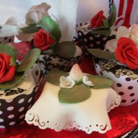 Cupcake Stand For State Fair Comp. 14 different cupcake dummies, with fondant and gumpaste, rice paper feathers.