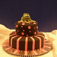 Frog Cake Black fondant, hot pink fondant accents, gumpaste frog. all at client's request. We don't know how the frog fits in but it did...