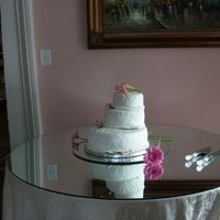 50Th Anniversary Cake This is a staggered 3 tiered butter pecan cake filled with caramel cream cheese filling, covered in fondant. Brushed embroidered flowers,...