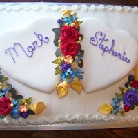 Wedding Cake With Flowers Heart shaped cakes on top of sheet cake. Flowers are gumpaste/mmf. Thanks for looking.