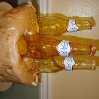 Dh Beer Cake My frist beer cake, not to bad but needs some more work. Beer Cake with Beer buttercream. Cover in MMF, and Sugar bottels.