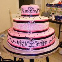 Pink, White, Black Wedding Cake This is a strawberry wedding cake, three stacks. It was so hard to make because my strawberry cake was so soft. I hate working with...