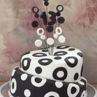 2Tier Topsy Turvey Black N White I made this for my daughters 13th bday couple of years ago my first ever topsy turvey cake. she didnt want girlie colours etc and decided...