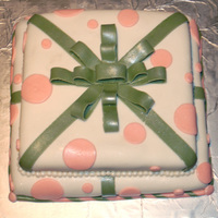 Gift Cake This is the third fondant cake I've made. I made it for a co-worker as a surprise for her birthday and she was definitely surprised...