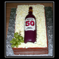 50Th Birthday Wine Crate Cake This was for a 50th birthday party. The cake was French Vanilla torted and filled with cherry filling. I made fondant and cut into planks...