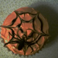 Spiderweb Cupcakes Made in 2008 for my son's Halloween Party at Preschool. Yellow cake, orange buttercream, black piping gel, and a platic spider ring.