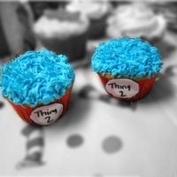 Thing 1 And Thing 2 Cupcakes Cupcakes made to match a Dr Seuss cake for first birthday. Buttercream and used the grass tip for top.
