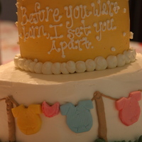 A Sweet Shower! Bottom tier- cookies n cream cake with mmf clothes. Top tier- chocolate banana cake with gumpaste baby booties!