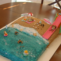 Summer Fun Cake Vanilla and Strawberry cake with vanilla buttercream. Beach/waterslide themed.
