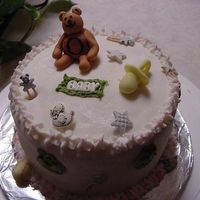 Neutral Colors my first baby shower cake, made a small 6inch cake, first time doing little characters, then made cupcakes to go with it. in blue and pink...