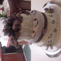 Laceys my daughters 20th bday cake, my first topsy turvy cake, not bad, room for improvement though.