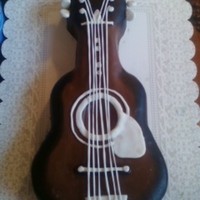 Guitar Cake My son was asked to make this for his principal. It is covered using Duff's chocolate fondant from Gartner studios. The principal said...