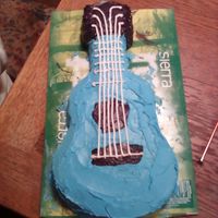 Guitar Cake This is a cake that my son decorated for our scout cake auction. He is 9 and had not had any formal cake decorating lessons before this.