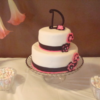 Sadie's Cake A simple little cake done for my sister-in-law's bridal shower. Ivory, pink and brown fondant.