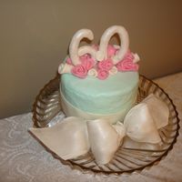 60Th Birthday Cake This cake made for my Mother-in-Law. Covered in buttercream, with 50/50 fondant and gumpaste for bow and "60". Roses are MMF.
