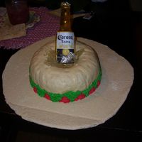 Fiesta Cake Sombrero is chocolate cake covered with bc and fondant. The corona bottle is a sugar beer bottle. TFL!