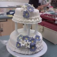 Wilton Class Wedding Cake I was really happy with my flowers on this, and my first tiered cake! I messed up in about 2-3 places while smoothing the fondant, but I&#...