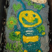 Bumble-Bee Birthday Cake i made this cake for my cusin who just turned 9. the backround colour is purple, the bee is blue and yellow, and the wings , flower and...