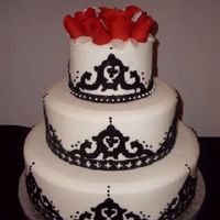 Moorish/spanish Wedding Theme Fondant with Arabesque fondant cutouts in black covered with black sugar glitter, black dragees, pearl dragees, red gumpaste roses with...
