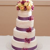 My First Wedding Cake White cake with lemon and raspberry filling. Frosting is crisco buttercream.