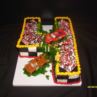 Big 4 2D cake. Carved from 1/4 sheet cake. All butter cream with red & black sprinkles.