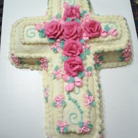 Cross Cake Pineapple cake with vanilla buttercream icing. Buttercream roses and the rest of the flowers are royal icing.