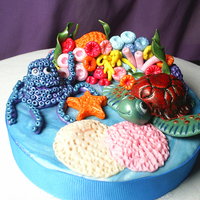Ocean Theme Cake topper for my husbands boss. 50/50 fondant, gumpaste mixture. Very fun and time consuming to make. TFL.