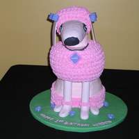 Pink Poodle The bottom part is two 8" round cakes and the middle is also two 8" cakes carves to resemble a sphere then placed on a 6"...