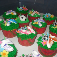 Soccer Cupcakes These were made for a little girl's soccer party. I added shoe laces after the picture was taken. Wish I had pictures of that, they...
