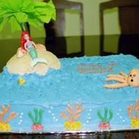 Mermaid Birthday Cake Mermaid 5th birthday cake. Buttercream icing, crushed vanila wafers for island, candy molded seashells, hand piped candy coral and kelp,...