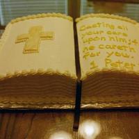 Open Bible Birthday Cake Buttercream with fondant cross. Gold pearl dust brushed on pages.
