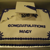 Graduation Cake BC icing w/fondant accents. Grad hat made from styrofoam ball and cardboard...TFL!