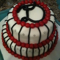 Danielle fudge cake, buttercream frosting, covered in fondant, fondant accents, silver dragees