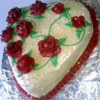 Golden Heart Of Roses The cake I made for my site creator's wife. It was VERY Moist & was injected with chocolate mousse. I airbrushed gold shimmer onto...