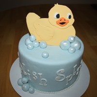 Splish Splash Baby Shower Cake Covered in fondant with fondant bubbles dusted with Pearl Luster Dust and duck was handcut, using a template, out of gumpaste.. TFL!
