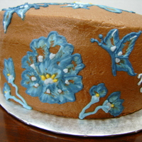 Blue Brush Embroidery Brush Embroidery (Royal Icing) on Chocolate Mocha Buttercream icing.