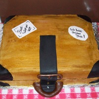 Going Away Party I made this for a friend at work who was leaving us. It is iced in buttercream and the "leather" is fondant.