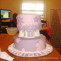 2 Double Tier On Blocks This cake is a double 8 and a double 6. Both torted into 4 layers total of chocolate and yellow cake. Covered in MMF, and BC. Did this cake...