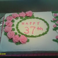 Roses In Bloom This is a cake I did for an anniversary . They wanted pink roses and that's what I gave them . I hope you enjoyed it as well .