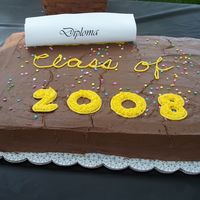 Graduation Double sheet cake. Chocolate swirl w/ chocolate B/C frosting.Free hand writing and numbers filled w/ b/c & star tip. Diploma created on...