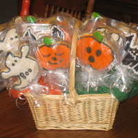 Ghoulish Lollipops Cut out cookies painted and decorated for Halloween giving. They are ghouls, bats, and of course, pumpkins! Happy Halloweeen!!!