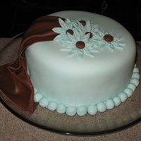 Fondant Covered Cake With Drape This was the first cake that I did in my fondant/gumpaste class. I used the cut out daisies and the drape for the first time. I love the...