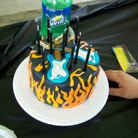 Rockband Cake all fondant - handmade rockband guitars - airbrushed flames and guitars