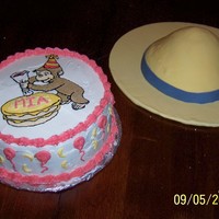 Curious George I made this for my daughter's second birthday. The hat was made with a wondermold pan and covered with fondant. The george cake is an...