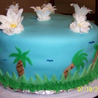 Luau Cake I made this cake for a luau party. It is covered with fondant with royal icing flowers on top. Thanks for looking