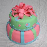 Tiered Dots & Stripes This is my first tiered cake and fondant bow, and my second fondant cake! It is a 10" white cake and 8" chocolate cake.